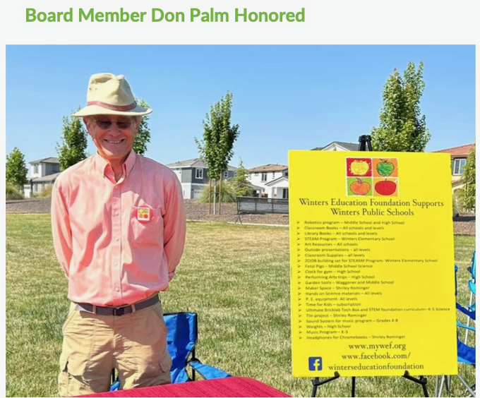 Don Palm standing by a WEF sign. Don Palm standing by a WEF sign.